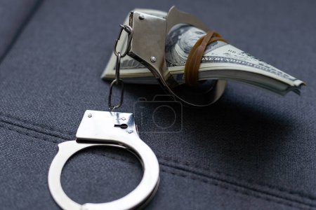 Photo for The handcuffs are on hundred-dollar bills. Power and bribery. Criminal ransom. Criminal earnings. Business concept. The concept of wealth. High quality photo - Royalty Free Image