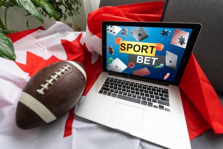 Photo for Laptop sports betting and canada flag. - Royalty Free Image