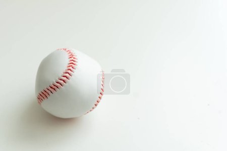 Photo for White baseball ball with red threads on white paper background. High quality photo - Royalty Free Image