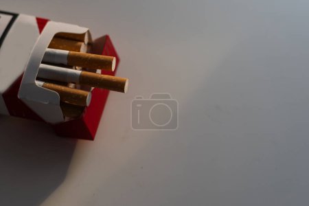 Photo for World no tobacco day. Close-up image of cigarette and stethoscope on white background. High quality photo - Royalty Free Image