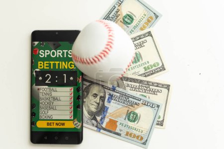 Photo for Smartphone with gambling mobile application and soccer ball with money close-up. Sport and betting concept. High quality photo - Royalty Free Image