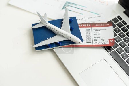 Photo for Airplane toy with passports and money on black background. Air trip and vacation. High quality photo - Royalty Free Image
