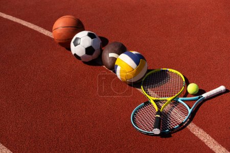 Photo for Set of sport equipment, soccer basketball balls and tennis rackets. - Royalty Free Image