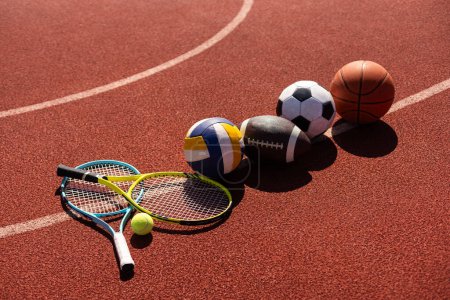 Photo for Set of sport equipment, soccer basketball balls and tennis rackets. - Royalty Free Image