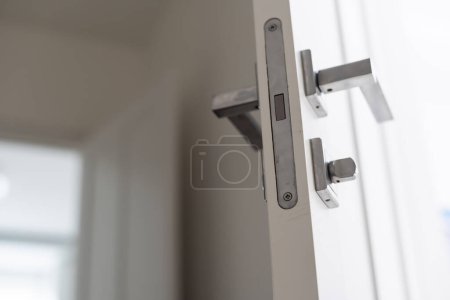 Photo for Wall mounted door stopper with modern door handle. High quality photo - Royalty Free Image