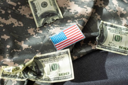 USA flag and money. Cash for VA loan from U.S. Department of Veterans Affairs. High quality photo