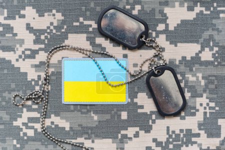Photo for Military ID tags and patch on pixel Ukrainian camouflage, closeup no war. High quality photo - Royalty Free Image