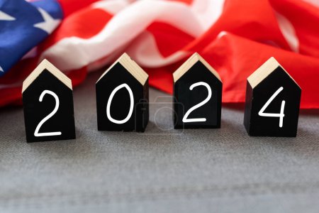Photo for United States presidential election 2024. Wooden cubes with the letters 2024 on the American flag background. Politics and voting conceptual. High quality photo - Royalty Free Image