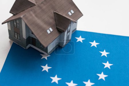 Photo for European Union symbol and small house.Isolated on white background.3d rendered. - Royalty Free Image