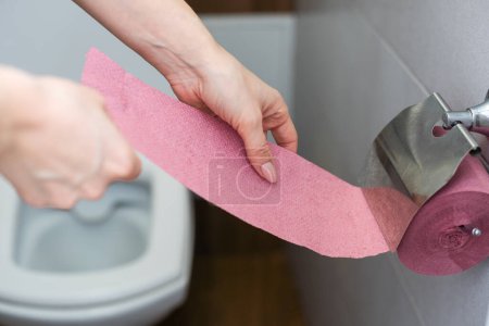 Photo for Close-up of in Hand using a toilet paper. High quality photo - Royalty Free Image