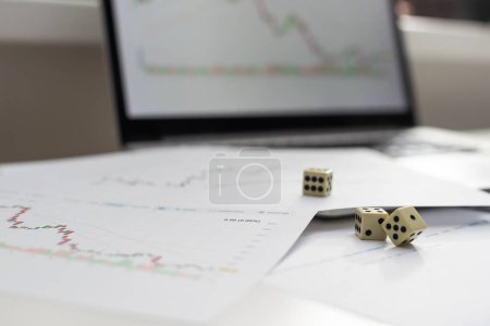 Photo for Dices cubes to trader. Cubes with the words SELL BUY on financial chart as background. Selective focus. High quality photo - Royalty Free Image