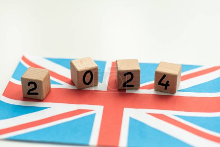 2024, United Kingdom, United Kingdom flag with date block, Concept, Important events for UK in the new year, election, economy, social activities, central bank, UK foreign policy. High quality photo