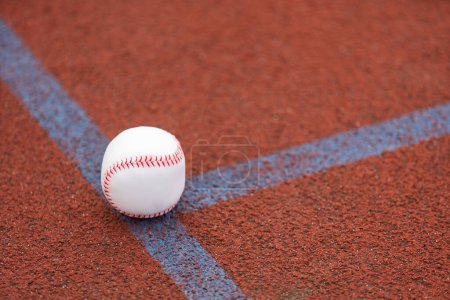 one baseball on infield of sport field. High quality photo