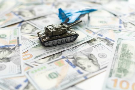 tank against the background of dollars. Concept of war. High quality photo