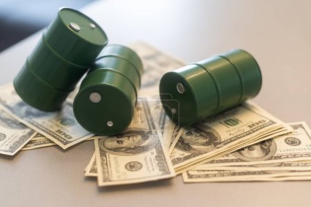 Barrel of crude oil with dollar bills. Close up. Business concept. High quality photo