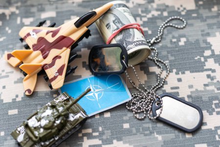 Photo for US flag patch with dog tag on multicam camouflage uniform. High quality photo - Royalty Free Image