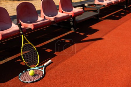 tennis racket with tennis balls on a tennis court. High quality photo