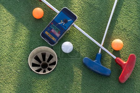mini golf sports betting on a smartphone. High quality photo