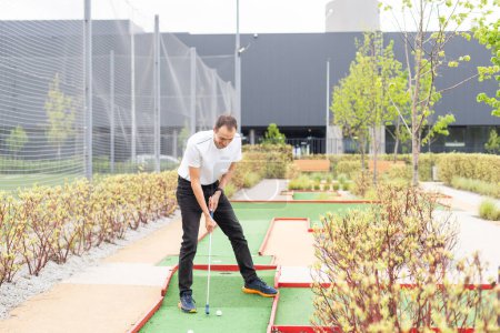 Photo for Minigolf player detail on green grass. High quality photo - Royalty Free Image