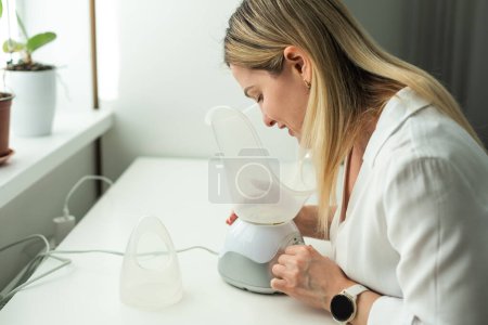 sick middle-aged woman breathing with inhaler portrait. High quality photo