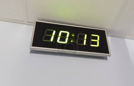 Black digital clock on a white background showing time 10 13 Secure Internet Day. High quality photo