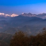 Landscape view of Snow clad Kangchenjunga, also spelled Kanchenjunga,with Valley view.
