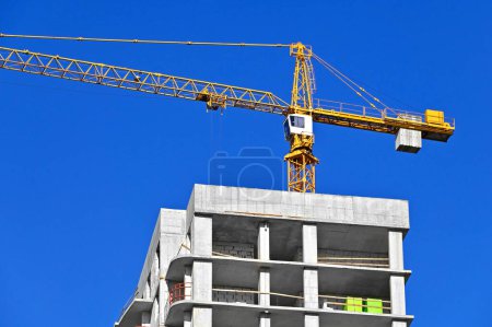 Building construction site with crane and sky