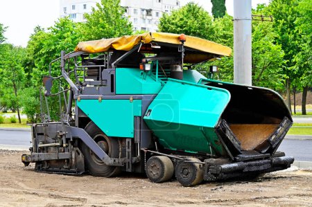 Photo for Asphalt paver machine on road construction site - Royalty Free Image