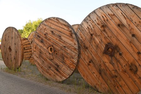 Large wooden coil of electric cable on construction site
