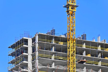 Photo for Highrise construction site and crane with blue sky - Royalty Free Image