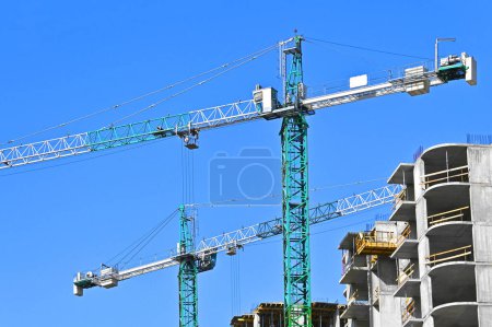 Construction site with tower crane and sky