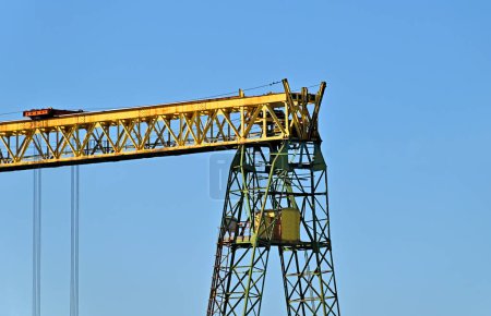 Full gantry crane over blue sky background