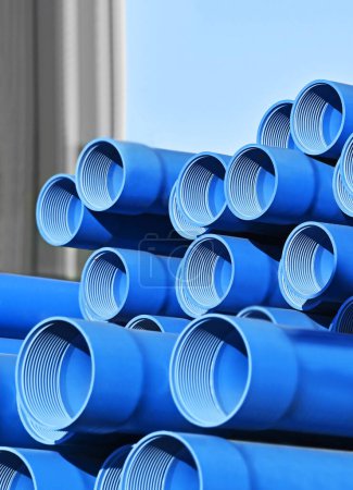Photo for Stacked polymer casing pipe for borewell on construction site - Royalty Free Image
