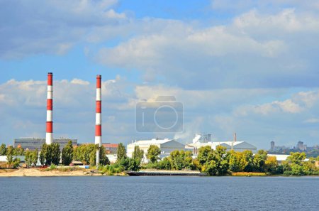 Photo for Chimney of thermal power plant (TES) 5 on industrial zone in Kyiv, Ukraine - Royalty Free Image