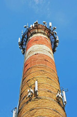 Photo for Old red chimney of boiler house from red brick - Royalty Free Image
