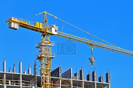 Photo for Monolithic construction site with crane and blue sky - Royalty Free Image