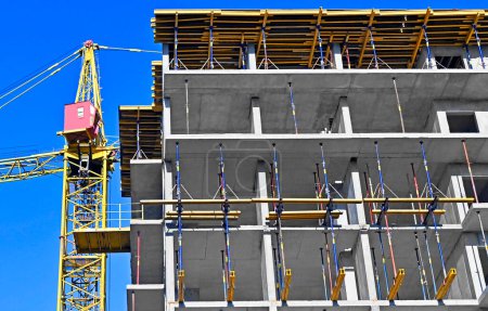 Photo for Multistage construction site with crane and blue sky - Royalty Free Image