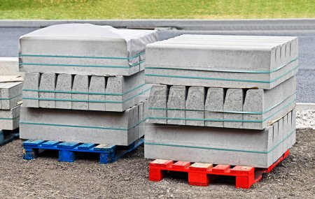 Stack of curbstones on pallets at construction site