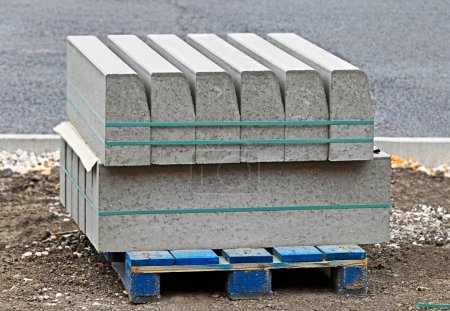 Photo for Stack of curbstones on pallets at construction site - Royalty Free Image