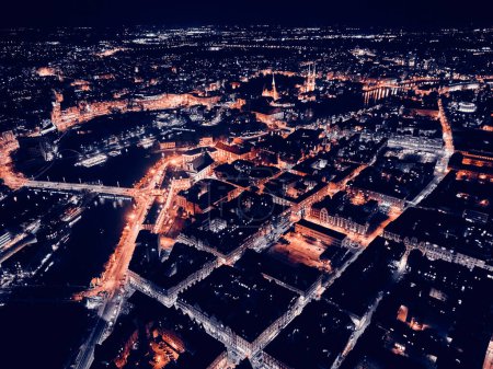 Aerial panoramic night view in the center of the old town, market square of Wroclaw (German: Breslau) - city in southwestern Poland, historical region of Silesia, Poland, EU - dark artistic styling.