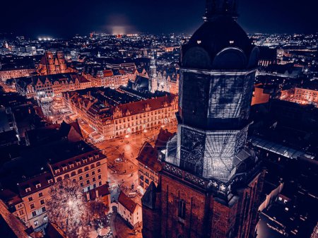 Aerial panoramic night view in the center of the old town, market square of Wroclaw (German: Breslau) - city in southwestern Poland, historical region of Silesia, Poland, EU - dark artistic styling.
