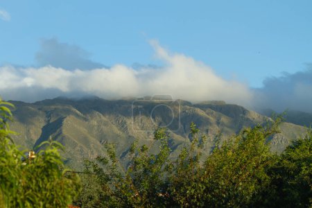 View of mountains with clouds over them