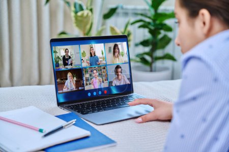 Photo for Video conference, teen girl student looking at laptop screen with group of teenagers studying remotely at home. Online lesson distance learning course. E-learning e-education technology high school - Royalty Free Image