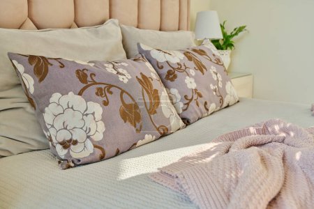 Photo for Sofa cushions on the bed close-up, in the interior of a classic bedroom in pink light ivory colors. Comfort, home, style, decor, design concept - Royalty Free Image