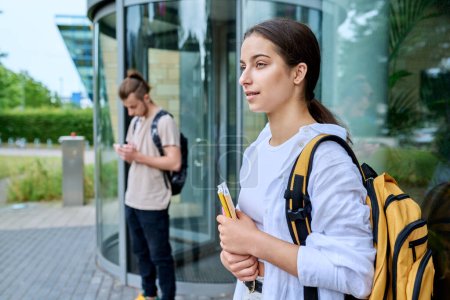 Photo for Portrait of high school student, smiling girl with backpack textbooks outdoor, educational building background. Adolescence, 15, 16, 17 years old, lifestyle, education concept - Royalty Free Image