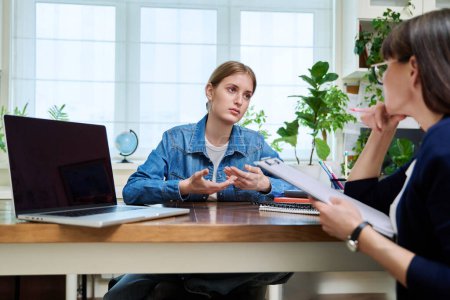 Photo for Young teenage girl high school student patient talking with psychologist, therapist, counsellor, social worker. Mental session therapy, support, psychology, psychotherapy, adolescence, youth concept - Royalty Free Image