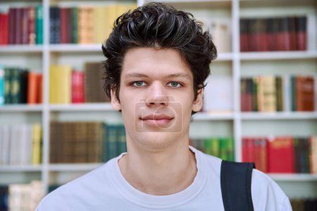 Photo for Headshot portrait of confident handsome college student guy with crossed arms inside library of educational building. Education, youth, lifestyle concept - Royalty Free Image