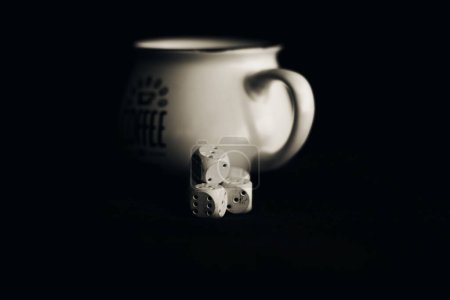 Photo for He put sugar cubes in the coffee. - Royalty Free Image