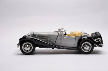 1930's Model of a vintage car on a white background with space for text