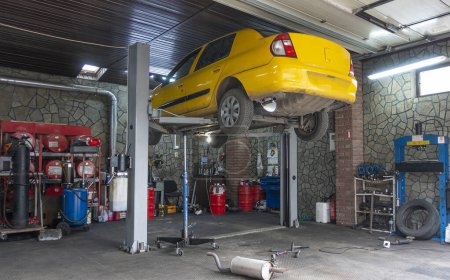 Photo for Kyiv. Ukraine. February 1, 2021 Car on a lift at an auto repair shop - Royalty Free Image